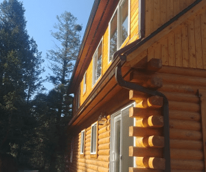 Best Buy Gutter downspout installation on log home