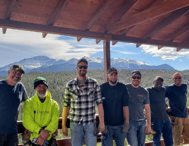 Best Buy Gutter Team photo on a sunny day with pikes peak in the background